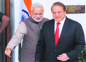 Fresh beginning: Prime Minister Narendra Modi ushers in Pakistan Premier Nawaz Sharif for talks at Hyderabad House in New Delhi on Tuesday