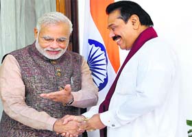 Prime Minister Narendra Modi with Mahinda Rajapaksa at Hyderabad House in New Delhi on Tuesday
