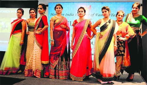 Students of the NIIFT, Mohali, during the unveiling of “Suvyan 2013” at a hotel in Sector 17, Chandigarh, on Friday