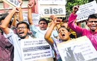Activists raise slogans against the UP Government in New Delhi