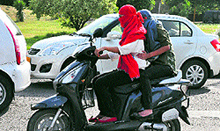 Girls protect themselves from scorching heat in Chandigarh on Saturday