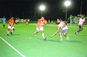 Players in action during the hockey festival in Jarkhar on Sunday