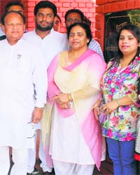 Moga MLA Joginder Pal Jain (L) with his family outside a Moga court on Monday