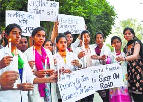 Students of Fishery College at Guru Angad Dev Veterinary and Animal Sciences University take out a candle march in Ludhiana on Wednesday
