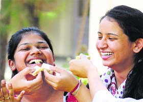 The Khalsa College for Women students Shaina Jain (centre) and Mehak Sehgal (right) in a jubilant mood after clinching the third and sixth positions, respectively, in the BCA-II examinations conducted by Panjab University, Chandigarh