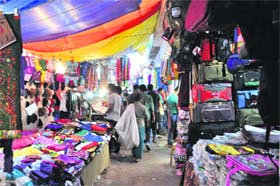 Encroachments by shopkeepers have narrowed the passage in Sadar Bazaar, Sector 19, Chandigarh
