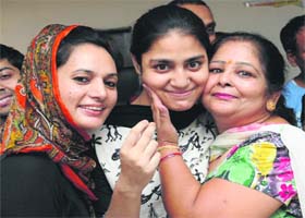 Jasmeet Kaur (centre), in a jubliant mood with her teachers in Chandigarh on Tuesday