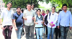 ABVP representatives and students of Shri Dhanwantary Ayurveda College Association at Panjab University in Chandigarh on Tuesday