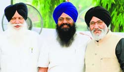 Tota Singh, Sohan Singh and Daljit Singh Cheema after being sworn in as Cabinet ministers in Chandigarh on Tuesday.