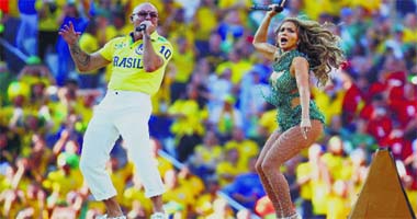 SOCCER MANIA GRIPS GLOBE: Singers Jennifer Lopez and Pitbull perform at the opening ceremony of the 2014 soccer World Cup at the Corinthians arena in Sao Paulo, Brazil, on Thursday