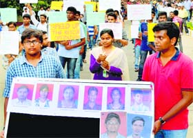 Students take part in a peace march for the 24 engineering students who were swept away in the Beas in Himachal Pradesh, in Hyderabad on Thursday