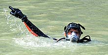 A Navy diver during a search operation in the Beas at Thalot in Mandi on Saturday