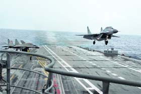 A fighter jet takes off from the newly inducted aircraft carrier INS Vikramaditya