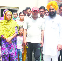 Shamsher Singh (wearing red cap) with his family in Batala.