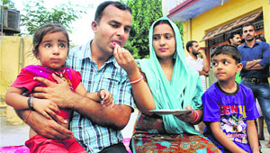 Rajesh Kumar, one of 40 Indian workers abducted in the Iraqi city of Mosul, with his family in Jammu.