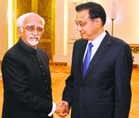 Chinese Premier Li Keqiang welcomes Vice President Hamid Ansari in Beijing on Saturday.