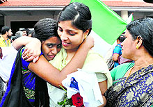 A nurse meets her relatives upon arrival at the Kochi airport on Saturday. Forty-six nurses were flown home from Iraq after hectic negotiations for their release