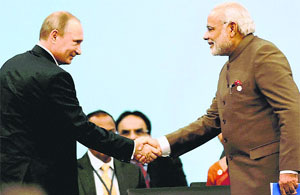 PM Narendra Modi greets Russian President Vladimir Putin at the 6th BRICS summit in Fortaleza, Brazil, on Tuesday.