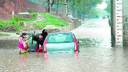 A car stuck on a water-logged road in Chandigarh
