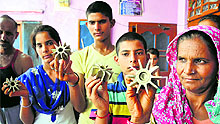 Villagers show tailfins of 81 mm mortars fired by Pak Rangers at Kaku De Kothey village in Arnia, Jammu