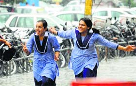 Joy knows no bounds: Schoolchildren enjoy the rain in Ludhiana on Monday