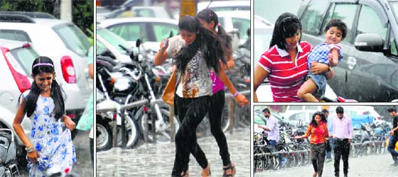 Draining out blues: Sudden showers took residents by a pleasant surprise in Ludhiana on Monday. The rain plummeted the temperature, giving everybody a reason to smile