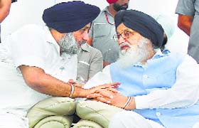 Punjab CM Parkash Singh Badal with SAD chief Sukhbir Singh Badal at a meeting in Chandigarh on Tuesday
