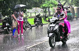 Residents enjoy light showers in Sector 42, Chandigarh, on Wednesday.