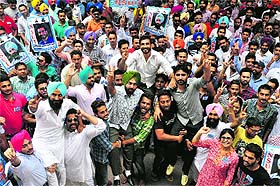 NSUI presidential candidate Rimpey Brar being lifted by supporters during campaigning for the student council elections at the Student Centre in Panjab University, Chandigarh, on Wednesday.