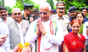 Haryana Governor Kaptan Singh Solanki along with his wife meets people after taking oath. CM BS Hooda is also seen