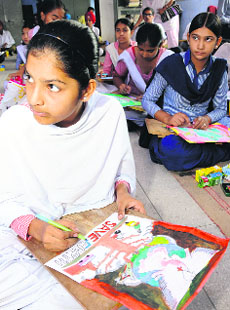 Students take part in a painting competition organised by the Nature Conservation Society, Punjab, on the eve of vanamahotsava at Government Senior Secondary School, Phase 3B1, Mohali, on Monday.