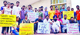 The National Students' Union of India members protest at Panjab University on Tuesday. The protesters demanded that the CSAT conducted by the UPSC as part of the civil services exam be conducted in regional languages.