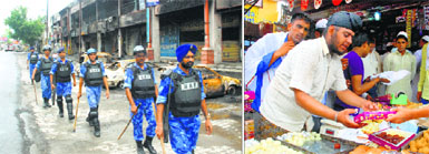 Rapid Action Force personnel on duty in Saharanpur, Uttar Pradesh, on Tuesday; and (right) a Sikh boy sells sweets in the city.