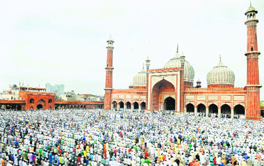 Muslims offer prayers on the occasion of Eid-ul-Fitr at Jama Masjid in New Delhi on Tuesday.
