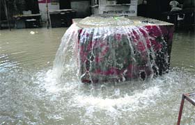 An overflowing manhole after the rain on Monday
