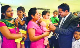 Representatives of a company interact with mothers during an interactive session in Ludhiana on Tuesday