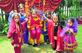 Children take part in the Teej celebrations at ABC Montessori School