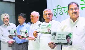 INLD leader Abhay Chautala (R) releases party manifesto