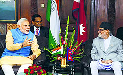 Prime Minister Narendra Modi with his Nepalese counterpart Sushil Koirala during a meeting at PMO Chambers, Singha Durbar, in Kathmandu on Sunday