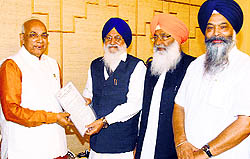 SGPC president Avtar Singh Makkar submits a memorandum to Haryana Governor Kaptan Singh Solanki in Chandigarh on Sunday