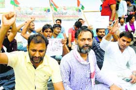 AAP leader Yogendra Yadav joins a protest being staged by UPSC aspirants in New Delhi on Tuesday
