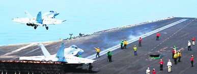 US Navys F/A-18C Hornet takes off from USS George HW Bush (CVN 77) in the Gulf to carry out air strikes against ISIL in Iraq on Friday.