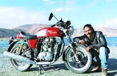 MEAN MACHINE: Aashish Thapa with his Royal Enfield Continental GT