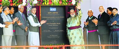Prime Minister Narendra Modi inaugurates the 45 MW Nimoo Bazgo power project in Leh on Tuesday. Also seen are Jammu and Kashmir Governor NN Vohra (3L) and Chief Minister Omar Abdullah (4L).