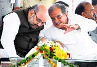 BJP president Amit Shah with Chaudhary Birender Singh at Haryana Nirman rally in Jind on Saturday.