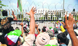 Supporters of Canada-based cleric Tahirul Qadri gather in front of Parliament during a protest in Islamabad on Wednesday.