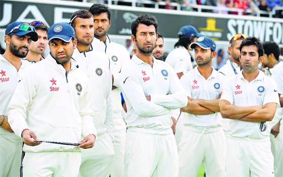 Dejected, India’s players look on during the presentations after losing the series against England in London, following spectacular batting collapses