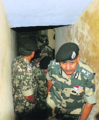 BSF DG DK Pathak comes out of a bunker at a village along the Zero Line in RS Pura sector. 