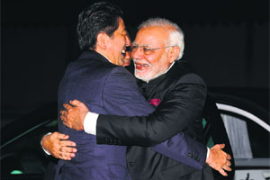 PM Narendra Modi (R) is welcomed by his Japanese counterpart Shinzo Abe at Kyoto on Saturday. 