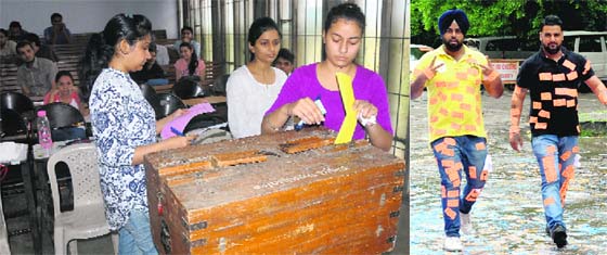 Students cast their votes at a department during the student council elections; and (right) PUSU supporters don party stickers at Panjab University on Friday.